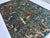 This hand-knotted Afghan pictorial rug is densely populated with peacocks, pheasants, and songbirds perched among...