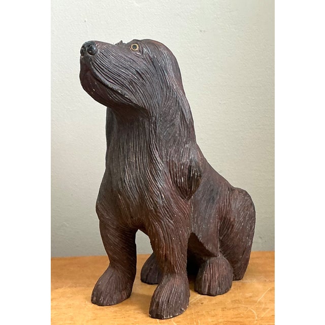 This vintage hand-carved wood dog sculpture beautifully captures the loyal spirit and graceful posture of a canine through...