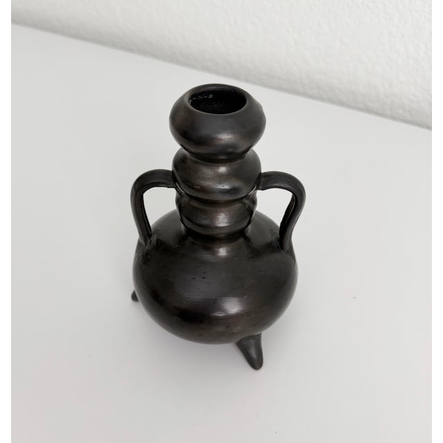 Unique black clay pottery vase with interesting curves. Crafted in Oaxaca, a region well known for their Barro Negro...