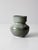 This vintage handmade studio pottery vase features a balanced, rounded form and a flowing glaze in soft grays, blues, and...