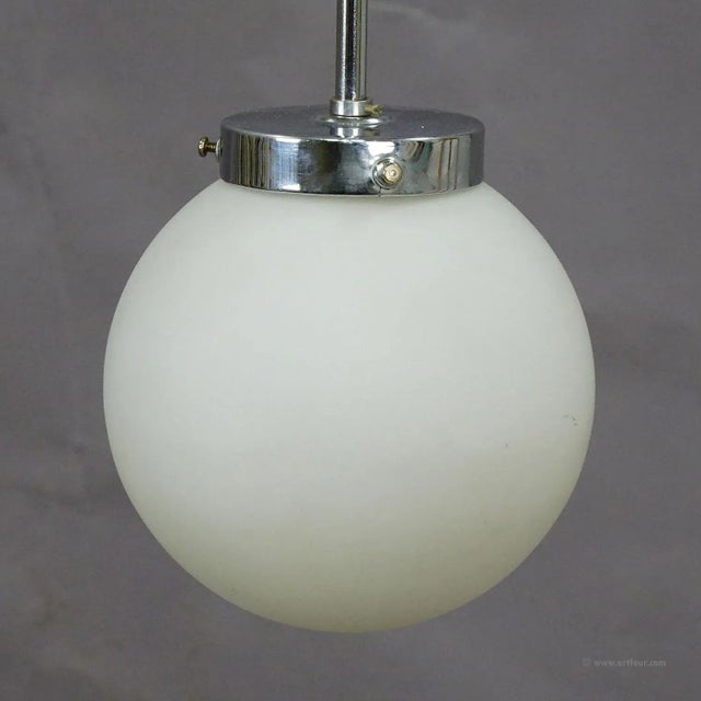 Functionalistic Bauhaus Style Pendant Light with Opaline Glass Shade An antique Bauhaus style pendant lamp with a white...