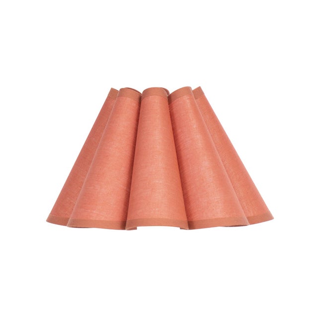Crafted from linen in a warm Wild Poppy hue, the Polly Alternate Shade features a gently scalloped form that adds quiet...
