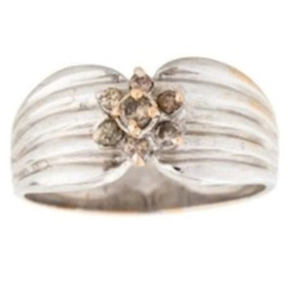 Lovely estate pinky band ring crafted in 18K white gold, featuring a delicate floral design adorned with 7 champagne...