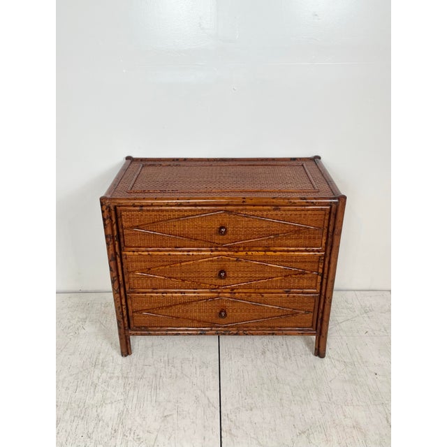 Vintage Bloomingdale's burnt bamboo/tortoiseshell finish rattan bachelor chest. 3 drawer chest of drawers wrapped in woven...
