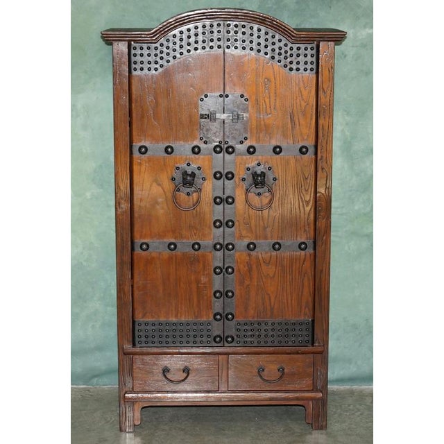 A wonderfully characterful Korean elm storage cabinet or Jang (장), dating to the late Joseon / early 20th-century period,...