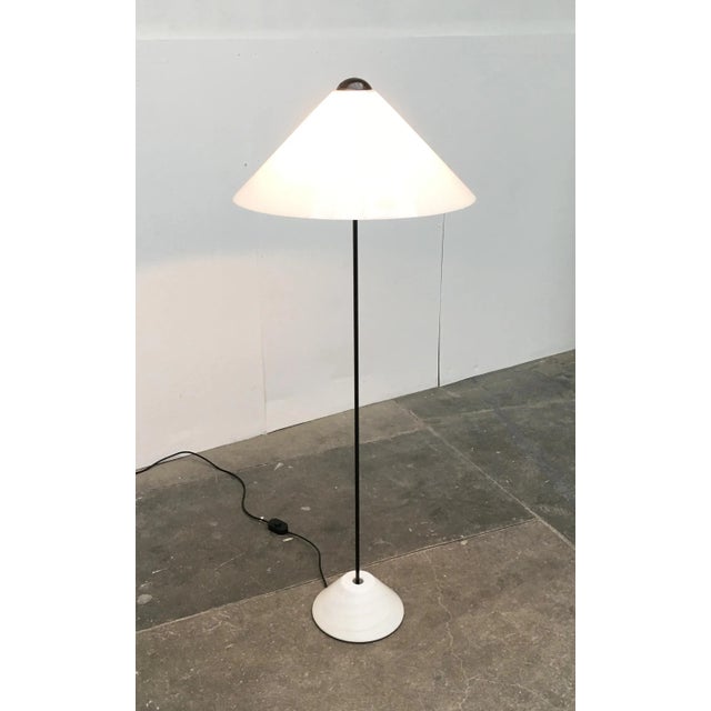 This is a very rare floor lamp from the italian manufacturer oluce after a design by vico magistretti from the early 70s....