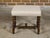 An English oak barley twist stool from the 19th century with cross stretcher and custom linen upholstery. This oak stool,...