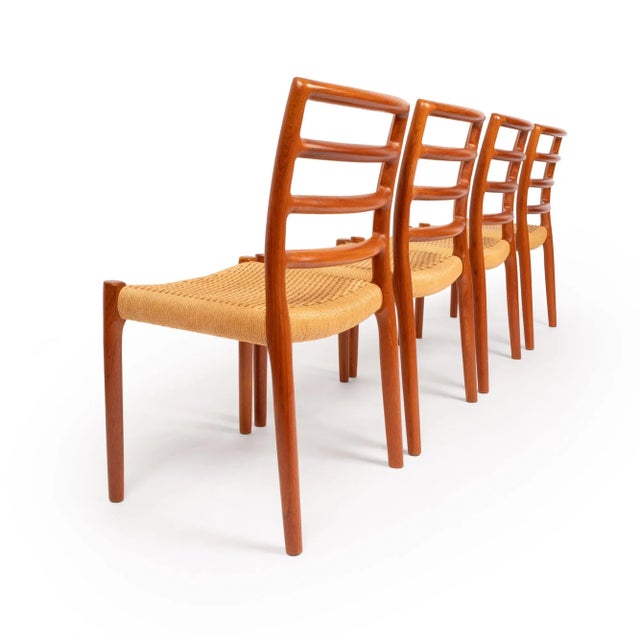 An exceptional Danish design classic, the Møller No. 85 side chairs were masterfully created in the 1950s by Niels Otto...