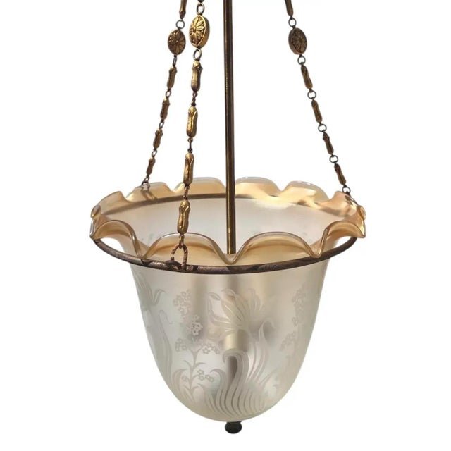 Elegant 1930s Art Deco pendant light featuing a frosted glass bell jar shade with finely etched floral and scroll motifs....