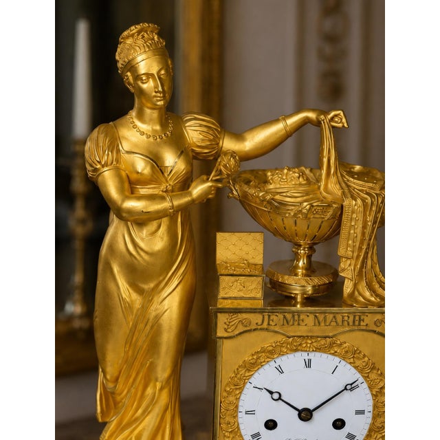 An exceptional early 19th-century French Empire mantel clock, crafted circa 1800–1805 and signed by P.F. Rouchouze of...
