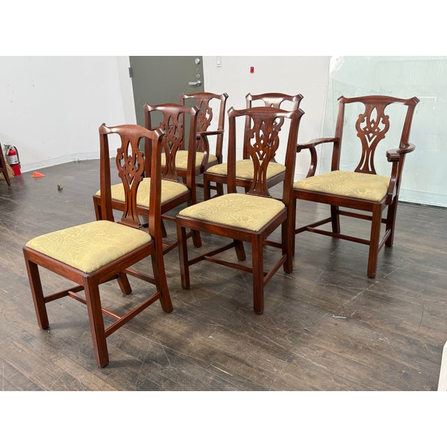 Design Plus Gallery presents a Set of Six Chippendale Chairs from Henkel Harris. The chairs are built on a mahogany frame...