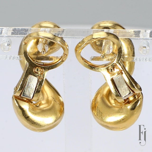 Here is a pair of 18k yellow gold "s" shaped latch back earrings. Total Weight - 7.03g