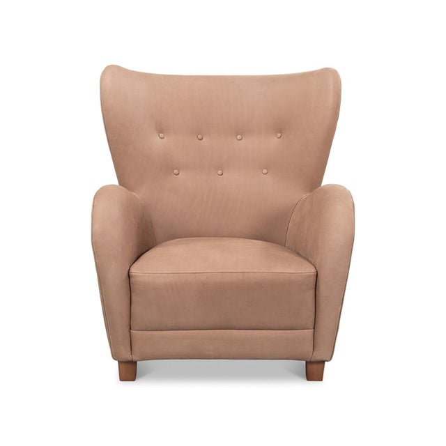 Upholstered in supple top-grain aniline leather, the chair boasts a soft, smooth texture that enhances its refined...