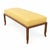 Mid century modern walnut bench with yellow chenille upholstery. The bench is done is the manner of Robsjohn Gibbings ....