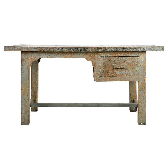 Vintage Patinated Wood Desk, in Good conditions. This piece is designed in the style of the selected designer and/or...