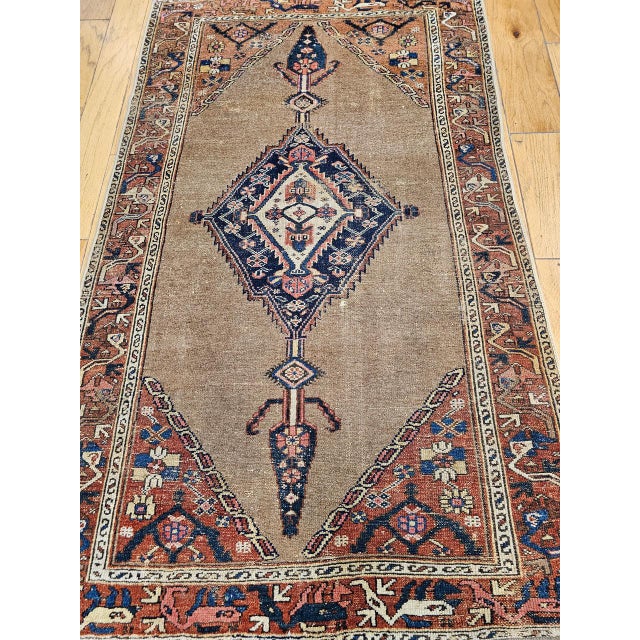 "Vintage Persian Malayer Camelhair area rug hand-knotted in the early 1900s. Malayer rugs, woven in the villages of...