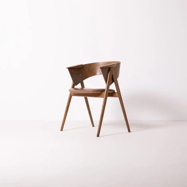 1 of 4 rare dining chairs attributed to Czech designer Filip Starek. Made of stained oak, oak veneered plywood and brown...
