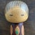 This exquisite sosaku kokeshi is crafted by Yuji Kawase. The body is adorned with real leaves and hand-carved plant...