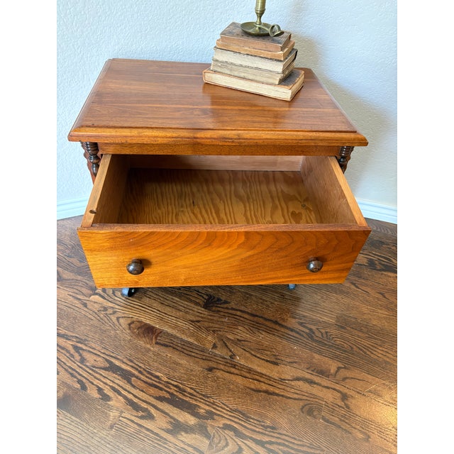 Crafted in the late 20th century, this handsome vintage rolling file cabinet combines traditional styling with everyday...