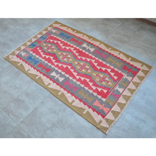 Flat weave Oushak Kilim Rug. Hand made fine area rug Dimension: 44" x 69" Excluding fringes Material: Wool on wool Origin:...