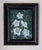 This artwork depicts a cluster of ethereal white moon flowers nestled among lush green foliage, creating a striking...