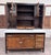 This is a stunning antique farmhouse Hoosier-style wooden kitchen cabinet from the early 20th century, featuring...