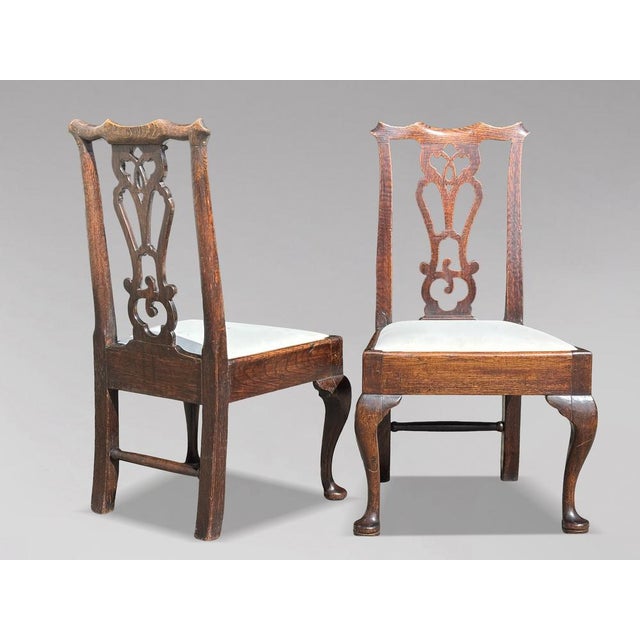 A handsome pair of 18th-century george iii oak side chairs, circa 1780 a fine and well proportioned pair of george iii...