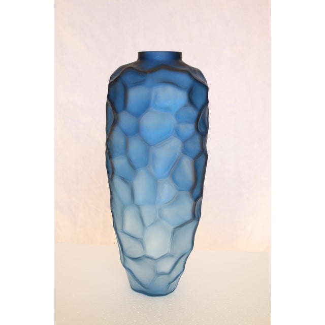 This tall blue vase is made off glass and is the perfect accent to any space. You can pair it with the smaller vase or...