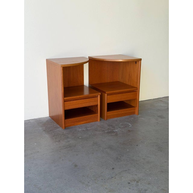 Pair of vintage Danish Modern teak nightstands, Made in Denmark, featuring clean Scandinavian lines and warm teak wood...