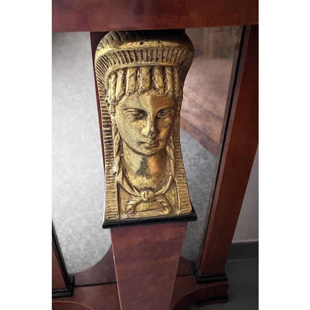 Empire-style half-moon console table, parisian manufacture from the 1970s. warm burl veneer with deep, rich tones. superb...