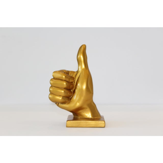 As an eye catching accent, this “Thumbs Up” hand symbol sculpture is sure to bring an uplifting and stylish vibe to any...