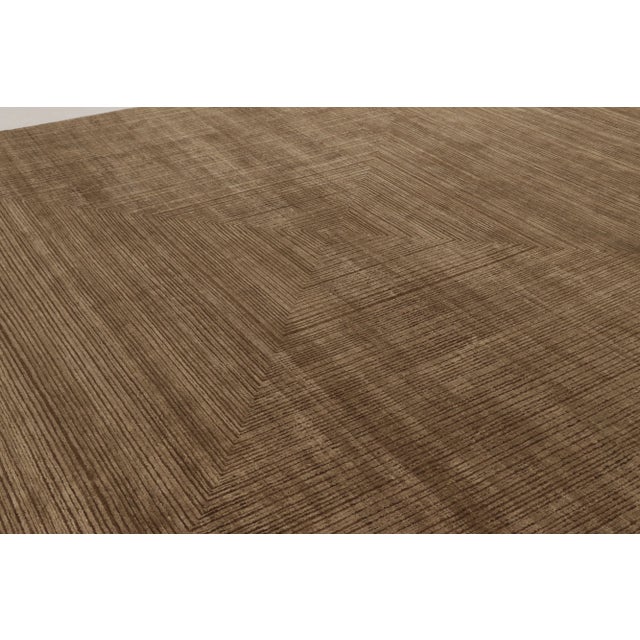 Hand-knotted in a luxurious blend of wool and luminous silk, this commanding 12 x 15 rug from Rug & Kilim’s Modern...