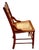 A late 19th century antique solid walnut Victorian Eastlake armchair with a hand carved back, burl walnut panel and hand...