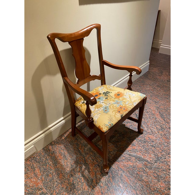 This is an elegant and comfortable antique wood chair that's well constructed. The brand is unknown.
