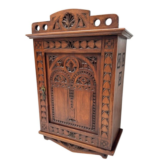 Magnificent and rare Arts & Crafts Art Nouveau wall cabinet. Striking Dutch design from the 1900s. Solid fruitwood base...