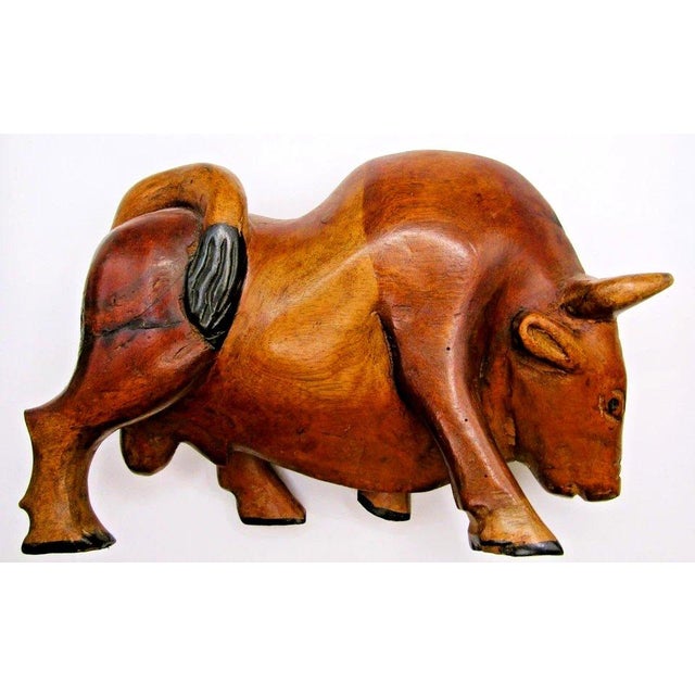 Large Vintage Mid-Century Modern Hand Carved Wood Bull Sculpture Measures 9 1/2" long, 3 1/2" wide and 6 1/2" tall. This...