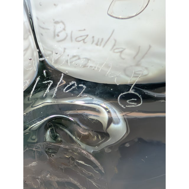 Striking handblown studio art glass sculpture by Peter Bramhall, signed and dated 1972. This substantial abstract form...