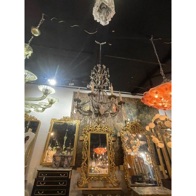 This 19th c. Italian Bronze and Crystal Chandelier exudes elegance and sophistication with its intricate design. Featuring...