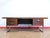 This Mid Century Modern Vintage Rosewood Writing Office Desk in the manor of Gorden Russell is a truly stunning rosewood...