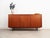 The sideboard was made in the 1970s, Danish production. The structure is covered with teak veneer. The legs are made of...