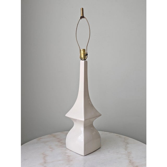 A Mid Centuty Modern glazed cermic table lamp with unique sculptural shape. New cord and plug. Measurements: lamp base...