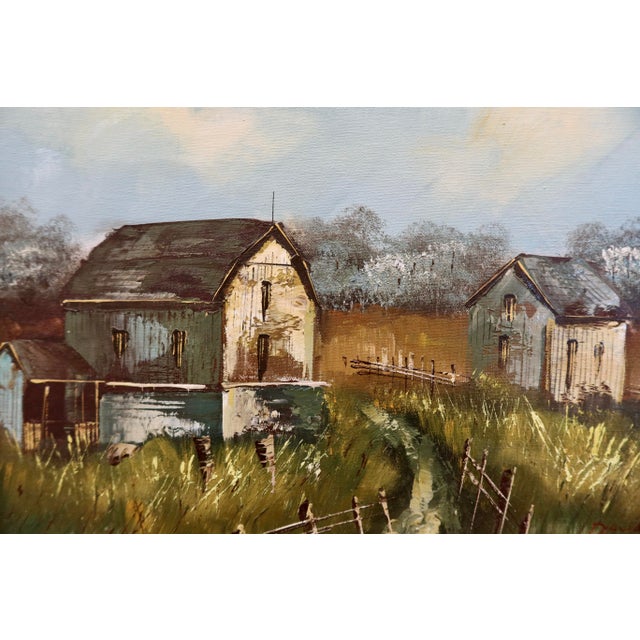 Original mid-century landscape painting on stretched canvas depicting a quiet rural scene with barns set among tall grass...