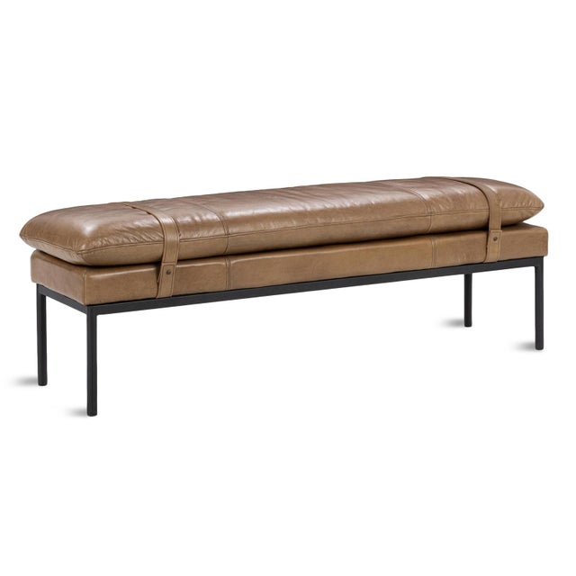 Modern farmhouse style bench with top grain leather upholstery. Plush pillowy seat cushion attached with two straps...