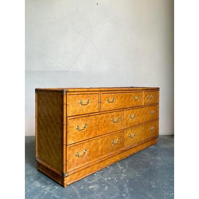 This striking dresser by Dixie Furniture captures the essence of 1970s Hollywood Regency and Coastal design, utilizing...