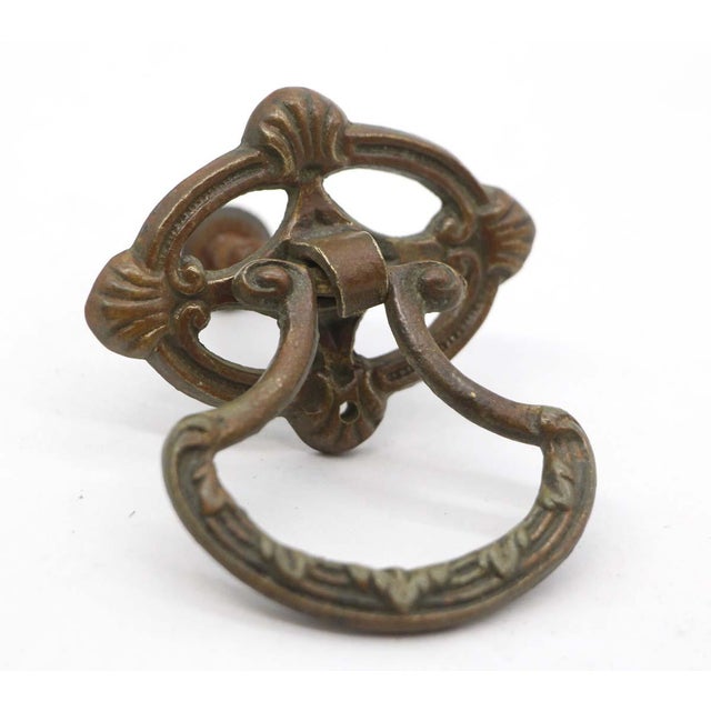 Art Deco style drop drawer pulls made of brass with a patina finish. Mounting screws are included. Good condition with...