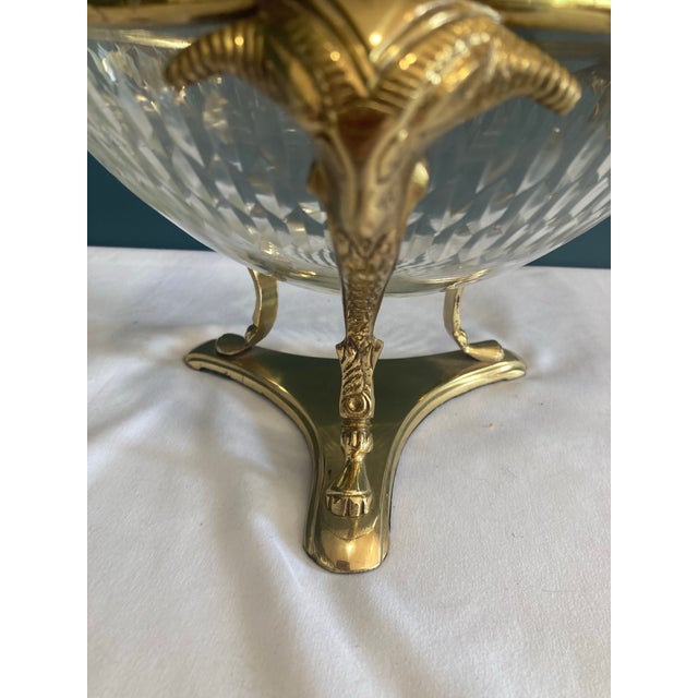 Beautiful glass bowl vase. Heavy and well made with unique brass base. The base has three sheep’s heads on the edges.