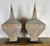 A striking pair of monumental zinc architectural finials, each featuring a tall faceted spire form with a tapered...