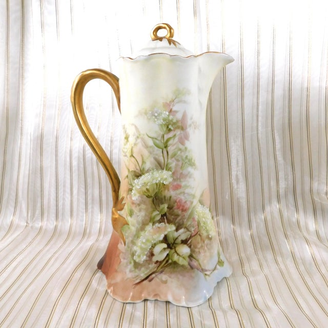 This is a pale tan Haviland Chocolate Pot with an 1888 to 1896 backstamp. The chocolate pot is a pale yelloy tan with a...