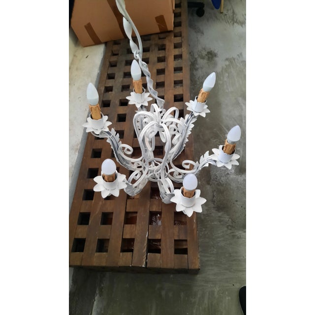 Beautiful wrought iron chandelier painted in white colour, with leaf shaped branches. The height together with hanging...