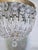 Add a touch of timeless, romantic glamour to your space with this exquisite vintage mid-century tiered brass crystal...